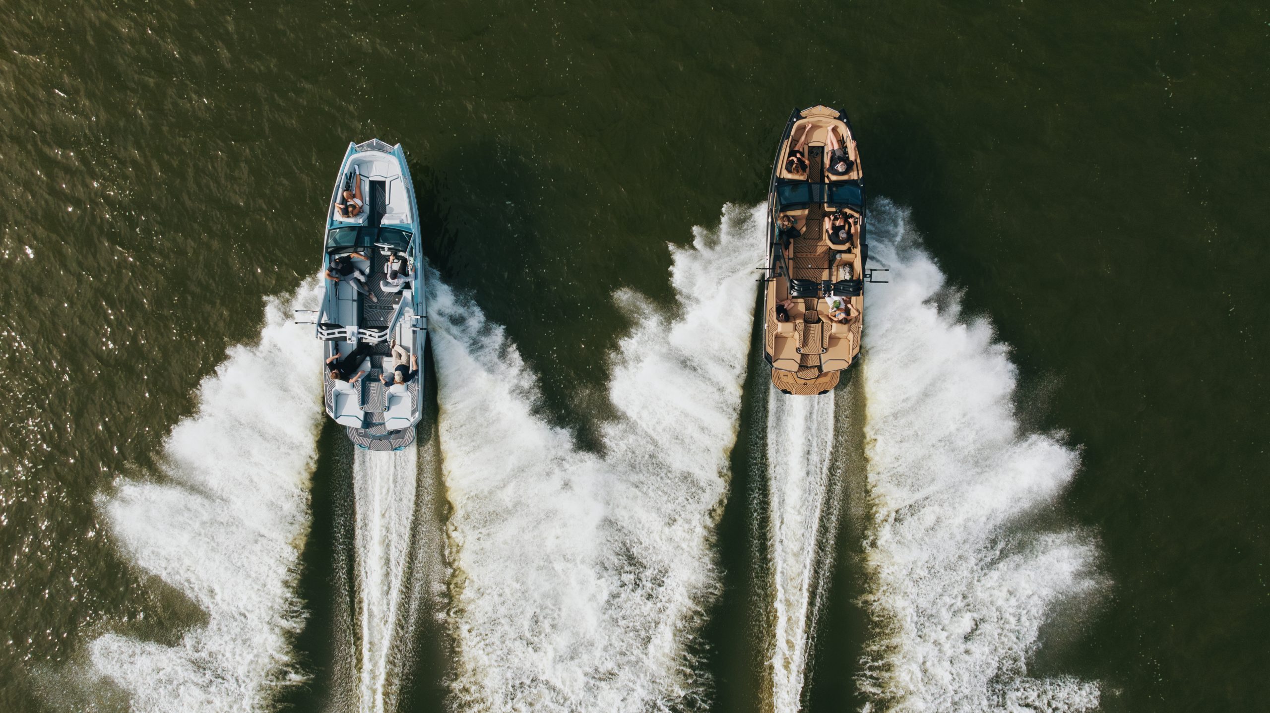 MasterCraft XStar wakeboarding boat navigating turquoise waters.